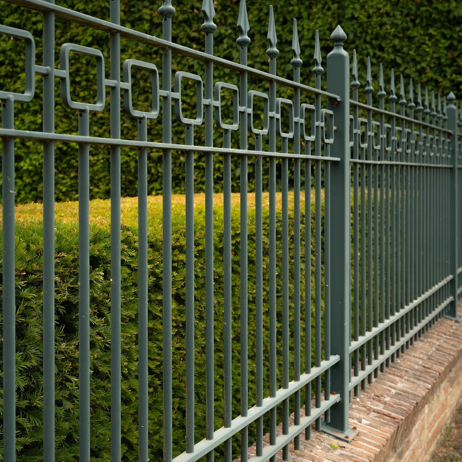 Restored deep-green garden railing