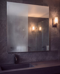 Same mirror, same steam: fogged on the left, coated and clear on the right