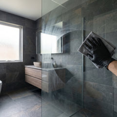Polishing the Claro-Tech+ haze off shower glass with the microfibre cloth